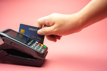 Man Hands swiping Credit card on Credit card machine or Credit card Terminal, Finance concept.