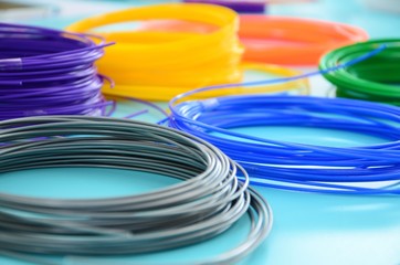 Plastic PLA and ABS filament material for printing on a 3D pen or printer of various colors - obrazy, fototapety, plakaty