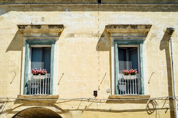 Fototapeta na wymiar Windows of an old building in Matera, south of Italy
