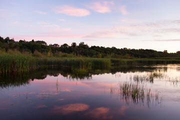 Fototapeta premium Pretty pink sunrise on the Léon-Provancher marsh during late summer, Neuville, Quebec, Canada, Neuville, Quebec, Canada