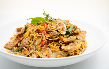 Stir fried noodles with clams and herbs, hot and spicy dish