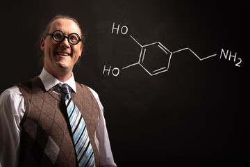 Professor presenting handdrawn chemical formula of dopamine