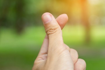 Closeup hand mini heart finger in outdoor