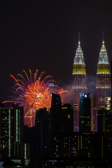 Fototapeta premium The Kuala Lumpur skyline glittered with a kaleidoscope of colours and spectacular lights and sound to mark the nation’s 62 years of independence of Malaysia.