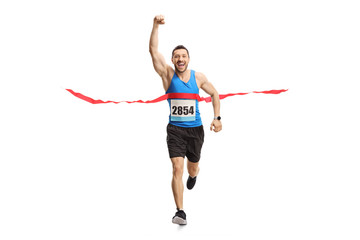 Man finishing a marathon and gesturing happiness with hand