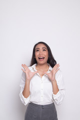 Excited young Asian woman look up.