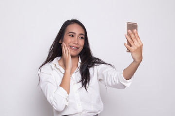Young Asian woman selfie with mobile phone.