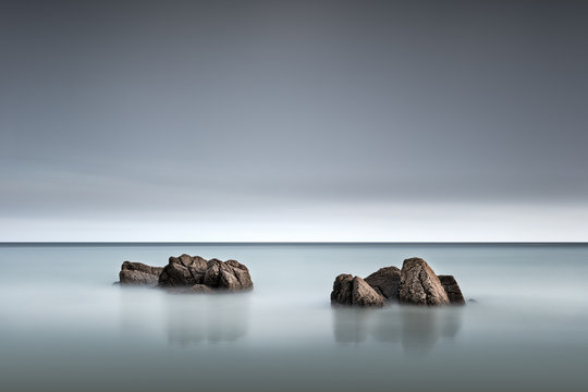 Waves breaking over a small group of rocks