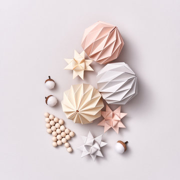 A set of Christmas handcraft paper and wood decorations on a gray background with copy space. Flat lay