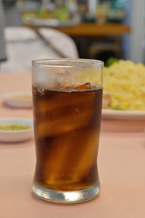 Cola in glass with ice in the restaurant.