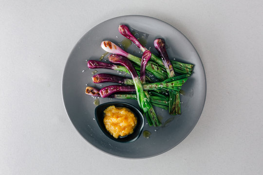 Plate of purple scallions