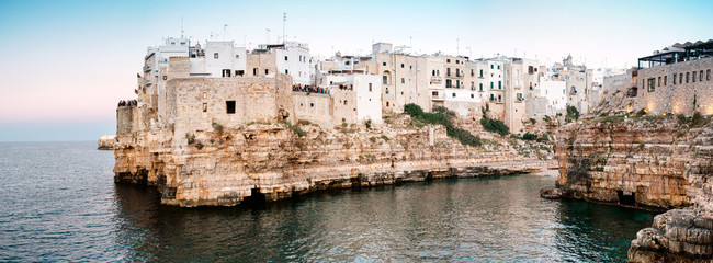 Polignano a Mare, Puglia Italy - August 20, 2109: Lama Monachile beach at sunset