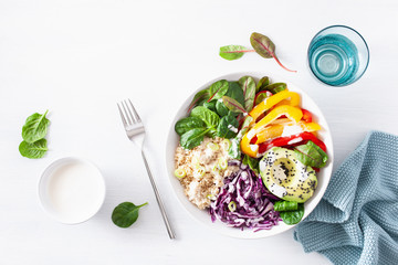 veggie couscous lunch bowl with avocado, bell peppers, spinach and red cabbage
