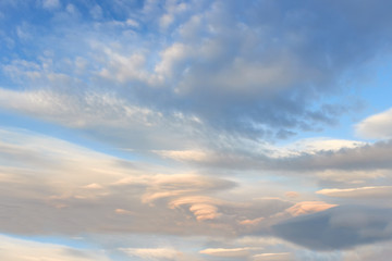 Fototapeta na wymiar Landscape with lenticular clouds at sunset blue sky