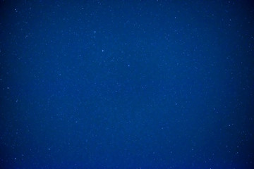 Night dark blue sky with bright stars as space background