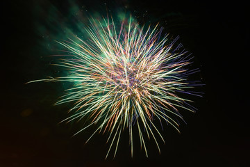 Obraz premium Holiday fireworks at night on black sky