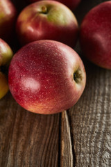 sweet ripe apples on brown wooden surface