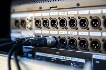 Audio snake and stage box with xlr cables and jacks at a live event