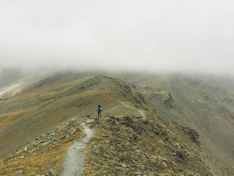 Female hiker looking at mountains
