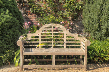 Bench seat in an english garden in early Spring