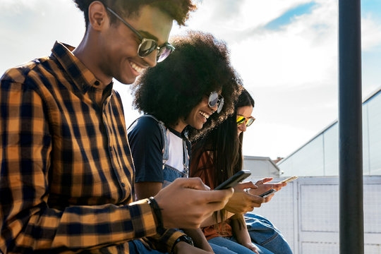 Group of happy friends having fun in the street