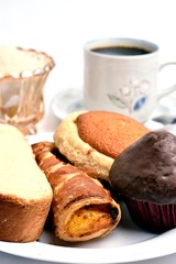 Traditional sweet bread, made with handcrafted veracruzanas, the name of the bread is chocolate pancake, pancha eye, pineapple puff pastry, butter slice, in the background a warm coffee with sugar