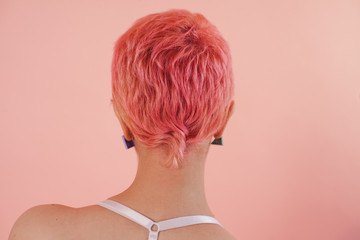 Neck of anonymous woman with pink hair