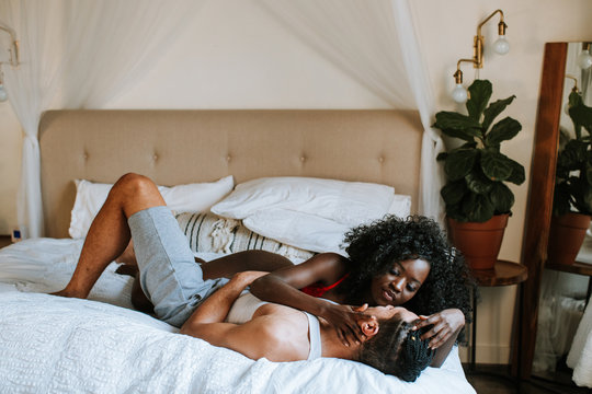 Beautiful Couple Snuggling on Bed
