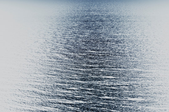 View from above of ocean waves and relfections