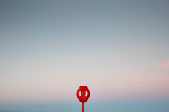 A lifebuoy against a clear sky