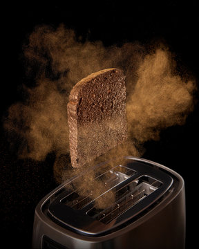 Jumping toast from the toaster on a black background. Preparing