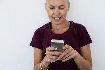 Sportswoman using smartphone.