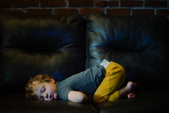 Toddler sleeping On Sofa