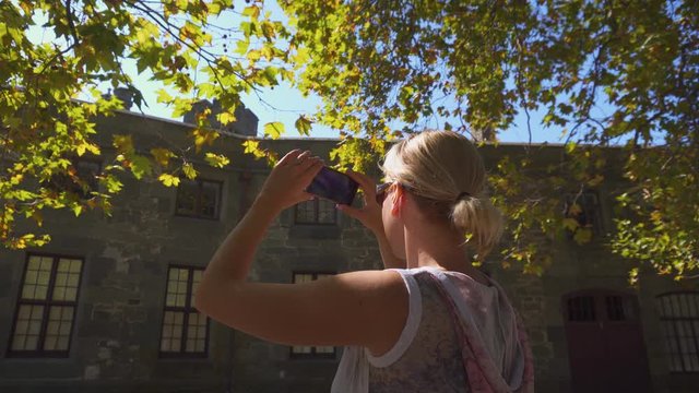 Woman Takes Pictures of Beautiful Nature on Sunny Day