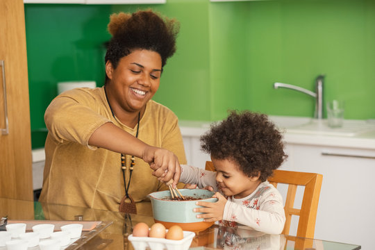 Happy Mother And Daughter Baking