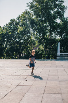 Happy Kid Running on a Plato