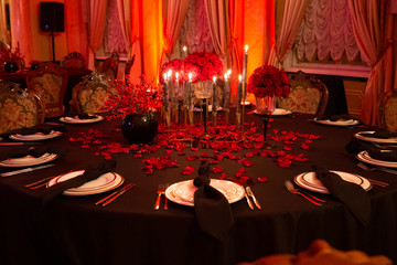 interior festive table evening dinner candlelight red