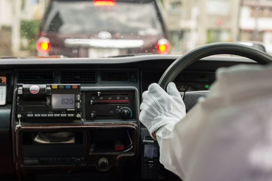 Gloved Hand Of Japanese Taxi Driver