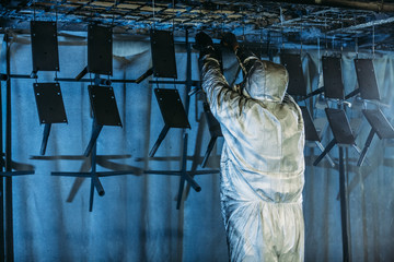 Worker painter at industrial factory