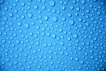 drops water on blue texture background