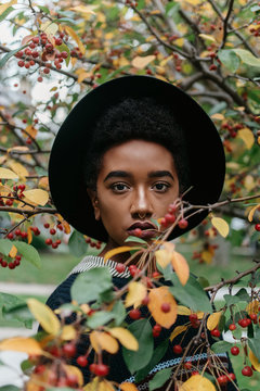 A beautiful young african american woman outside on an autumn day