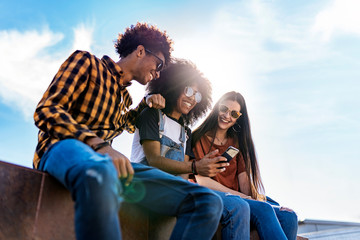 Group of happy friends having fun in the street