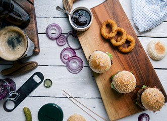 Mouth-watering burger on wooden board