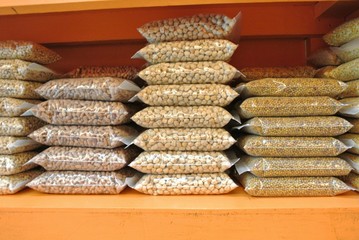 Whole grains in plastic bags placed on shelves to sell products