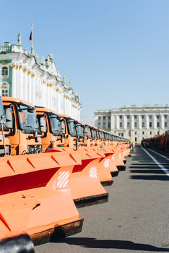 Heavy machines near beautiful building