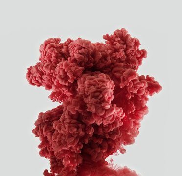 Explosion of bright red smoke ink