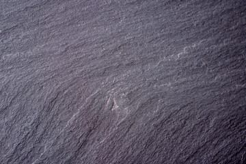 Closeup of dark gray stone surface