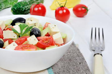 Vegetables salad with cheese in a bowl