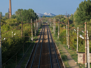 Fototapeta premium Railroad way going to hills