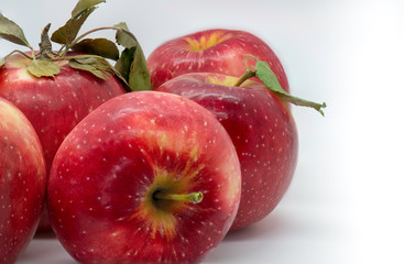 one apple on side of group of apples 